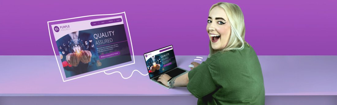 A smiling woman working on a laptop